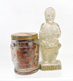 'Safety First' baby at barrel glass
