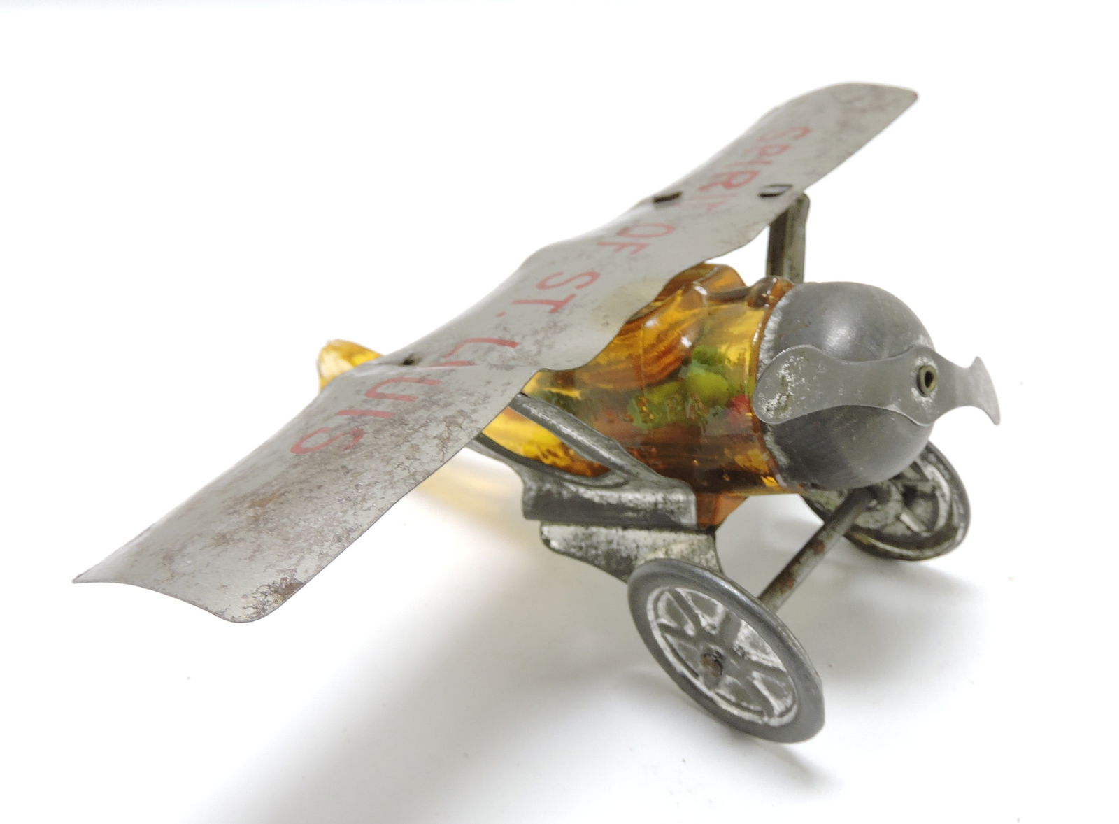 'Spirit of St. Louis' airplane glass candy: container with amber glass body, 5"l, 6 1/4"w