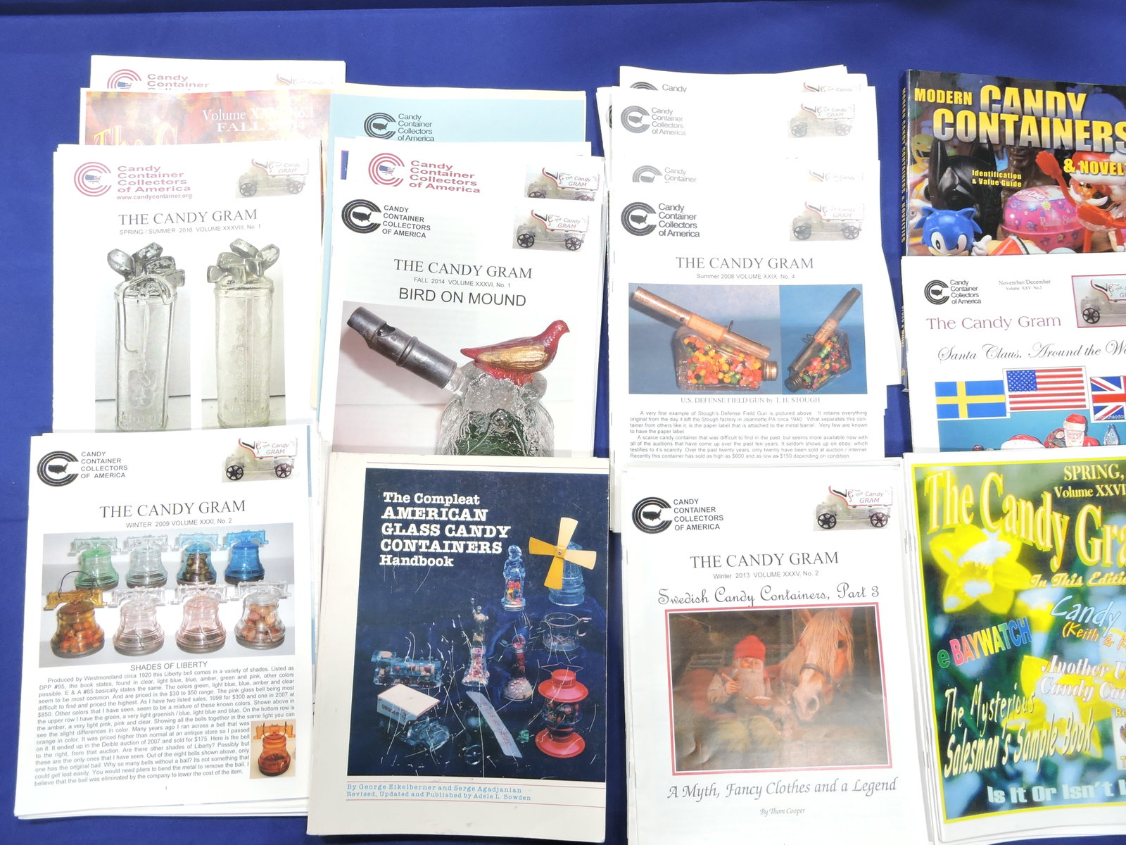 Box of glass candy container: reference books and 'The Candy Gram' newsletter
