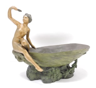 Bronze figure of lady on edge of