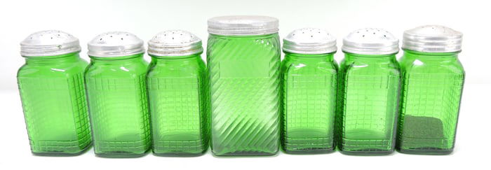 Lot of 7 green glass shakers and jar,
