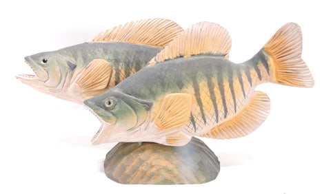 Wood carving of a pair of fish,