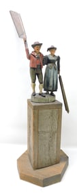 Hand carved whirligig with man and