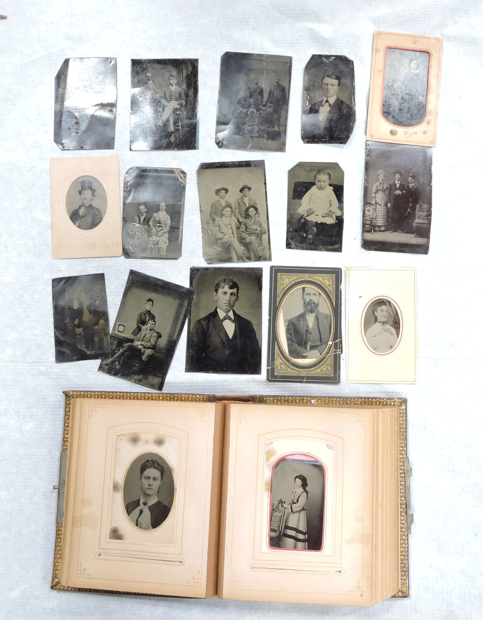 Photo album with tin types and: extras, 36 tin types total