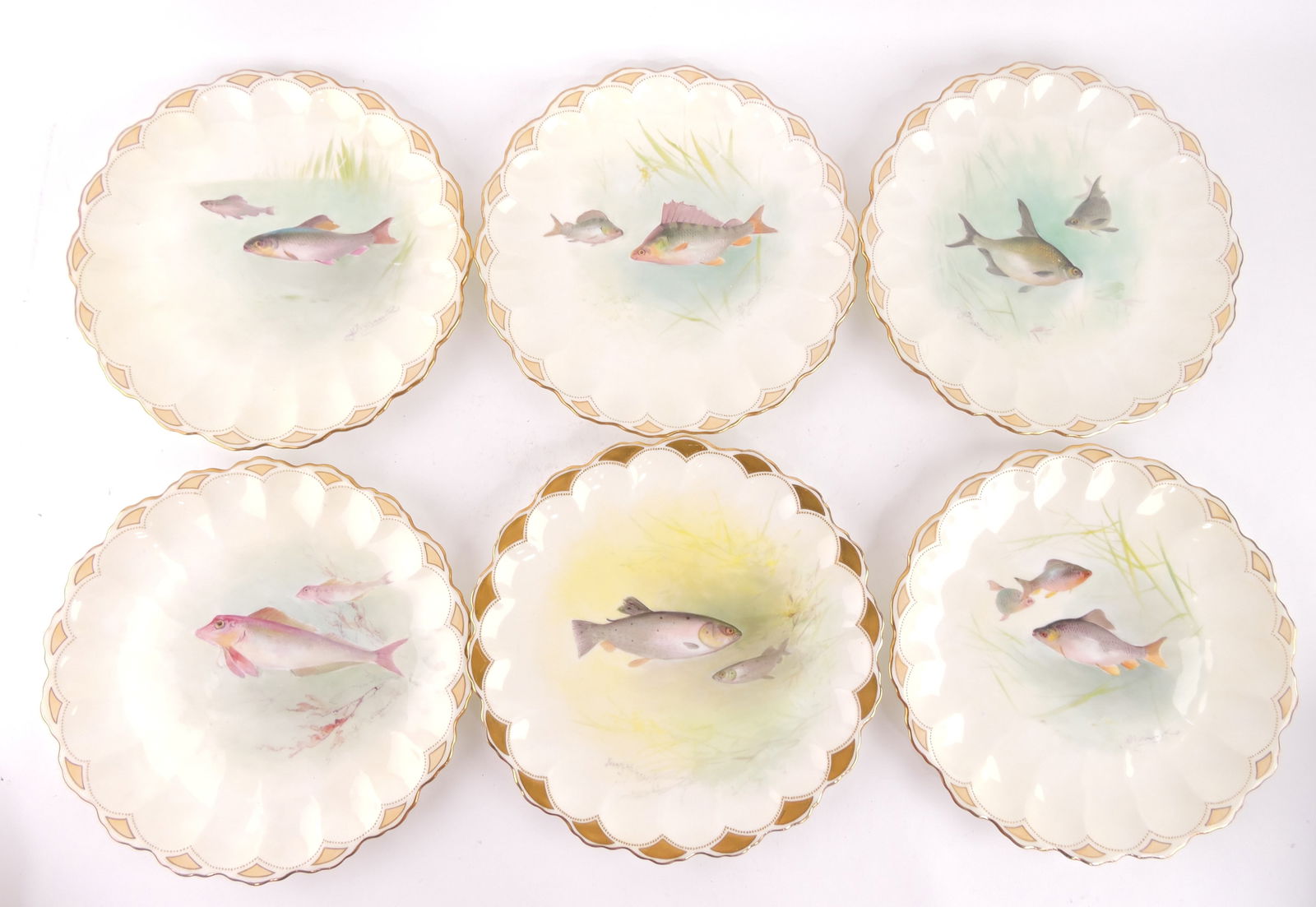 Doulton Burslem bone china set of: 14 - 8 3/4" fish plates with scalloped gilt border, each with hand painted artist signed underwater scene