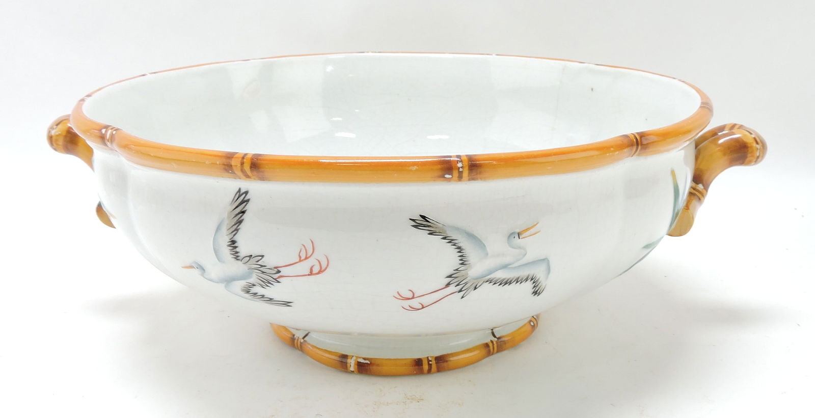 Minton porcelain bowl with bamboo: trim and handles, storks in flight decor, 4 1/2"h, 12 1/2"w, minor hairline