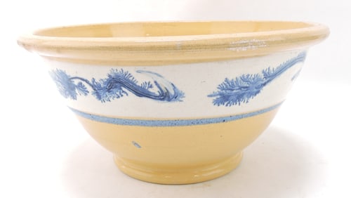 Yellow ware bowl with blue seaweed,