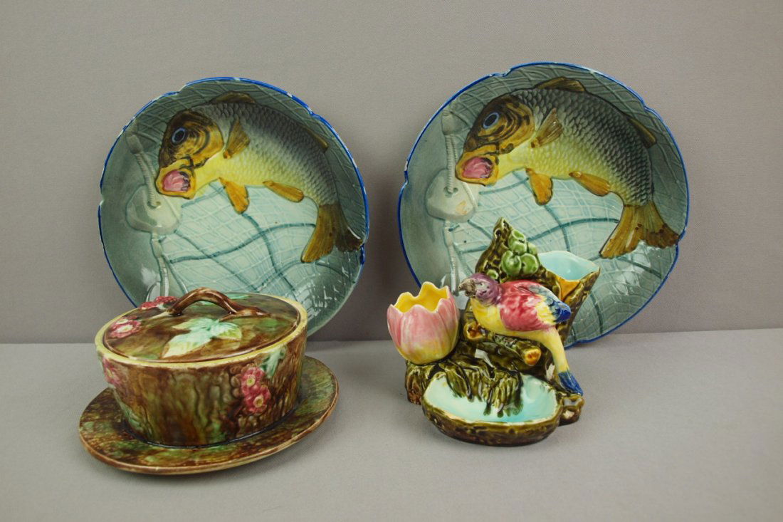 Majolica lot of 4 pieces - mottled butter tub, bird : Majolica lot of 4 pieces - mottled butter tub, bird match striker and pair of French fish plates, various condition