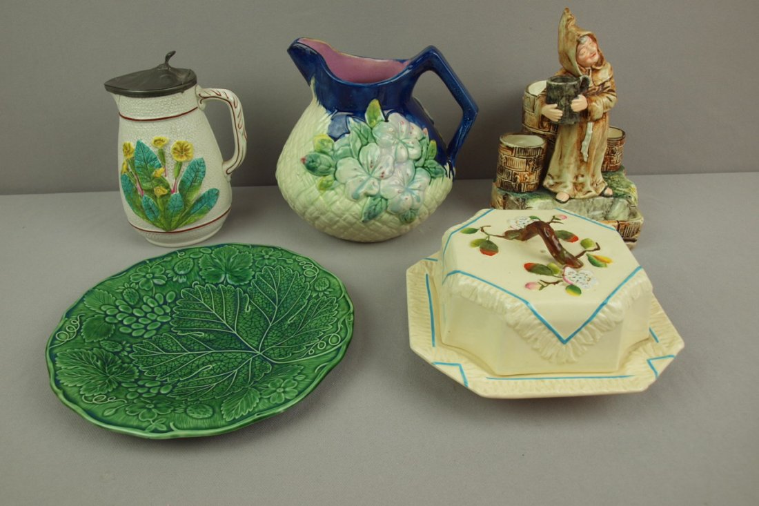 Majolica lot of 5 pieces - George Jones albino butte: Majolica lot of 5 pieces - George Jones albino butter dish, monk match striker, dark green fruit plate, albino syrup pitcher and cobalt basketweave and floral pitcher , various condition