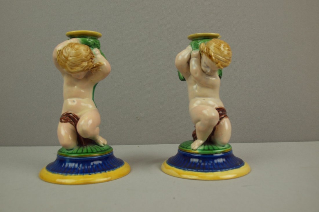MINTON majolica pair of putti candle bases used as c: MINTON majolica pair of putti candle bases used as candle holders, 6 1/2", rim chips to one