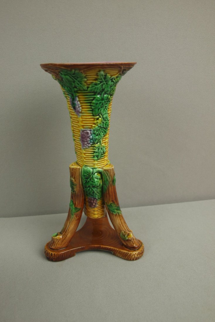 GEORGE JONES basketweave tri-footed trumpet vase wit: GEORGE JONES basketweave tri-footed trumpet vase with grapes, 8", professional rim and foot repair