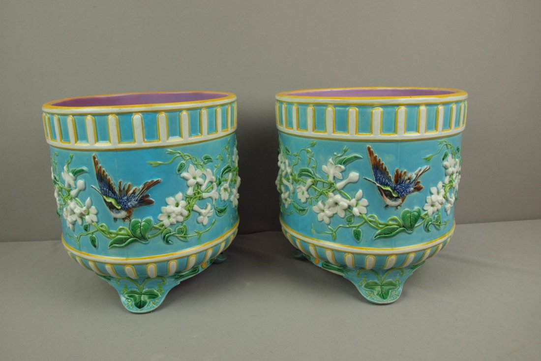 GEORGE JONES majolica pair of jardinieres with hummi: GEORGE JONES majolica pair of jardinieres with hummingbirds and honeysuckle, great color and detail, 11"h, 11"d, professional hairline repair to one and base repair to the other