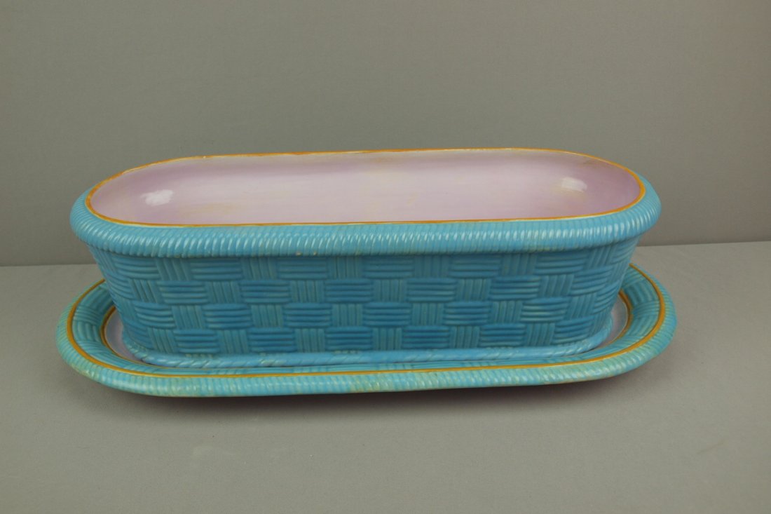 MINTON monumental rare majolica basketweave oval w: MINTON monumental rare majolica basketweave oval window jardiniere with matching undertray, date code for 1863, 25"l, professional repair to hairline in base, very rare form