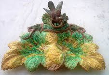 HUGO LONITZ high decorative majolica serving dish: HUGO LONITZ high decorative majolica serving dish modelled as a nesting bird on branch with rushes and two large leaves, 14", nice quality, hairline to leaf, professional repair to tail feathers of bi