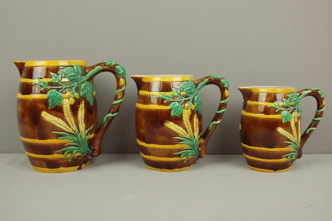 GEORGE JONES majolica set of three barrel and hopps : GEORGE JONES majolica set of three barrel and hopps jugs, nice color, 7", 6" (minor spout glaze wear) and 5", good color