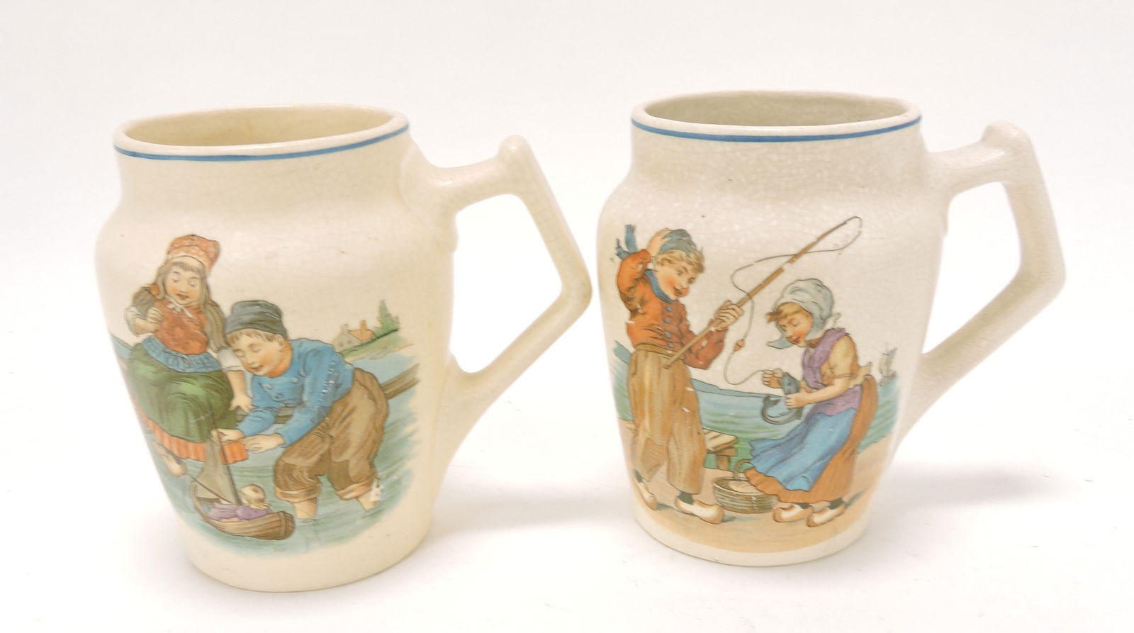 Roseville lot of 2 Dutch mugs, 5": .