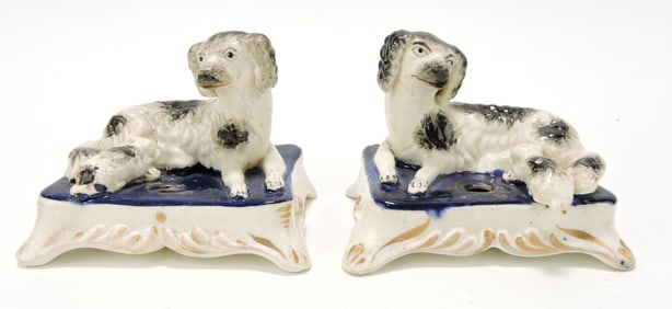 Staffordshire pair of dogs with pups seated