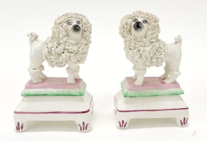 Staffordshire pair of poodles on stand,