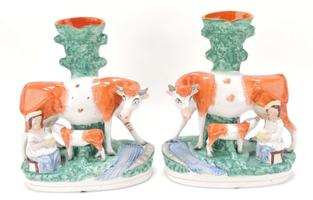 Staffordshire pair of spill vases with cow,