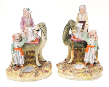 Staffordshire pair of figures with camel