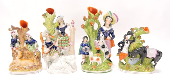 Staffordshire lot of 4 figural spill vases,