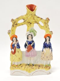Staffordshire spill vase with three young