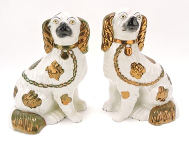 Staffordshire pair of copper luster spaniels,