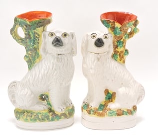 Staffordshire pair of spaniel spill vases,