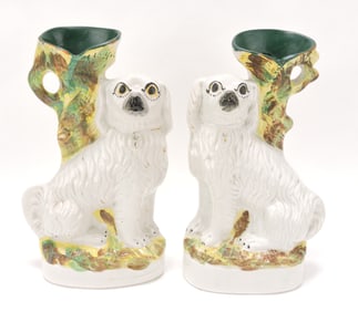 Staffordshire pair of spaniel spill vases,