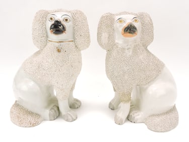 Staffordshire pair of free leg poodles,