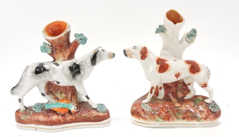 Staffordshire pair of dog spill vases,