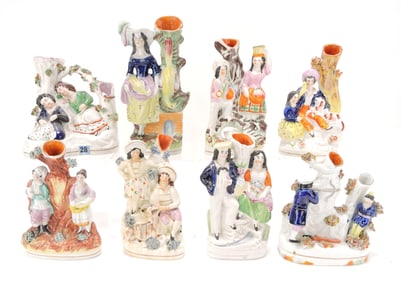 Staffordshire lot of 8 figural spill vases,