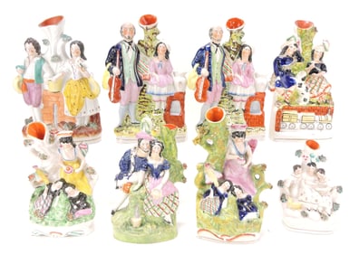 Staffordshire lot of 8 figural spill vases,