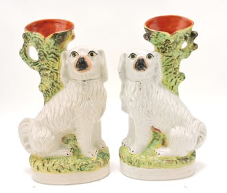 Staffordshire pair of spaniel spill vases,