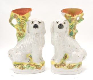 Staffordshire pair of spaniel spill vases,
