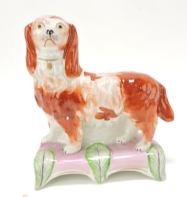 Staffordshire russet spaniel on plinth,