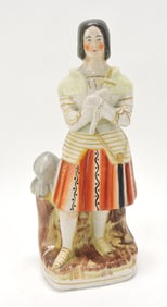Staffordshire figure of girl with dagger,