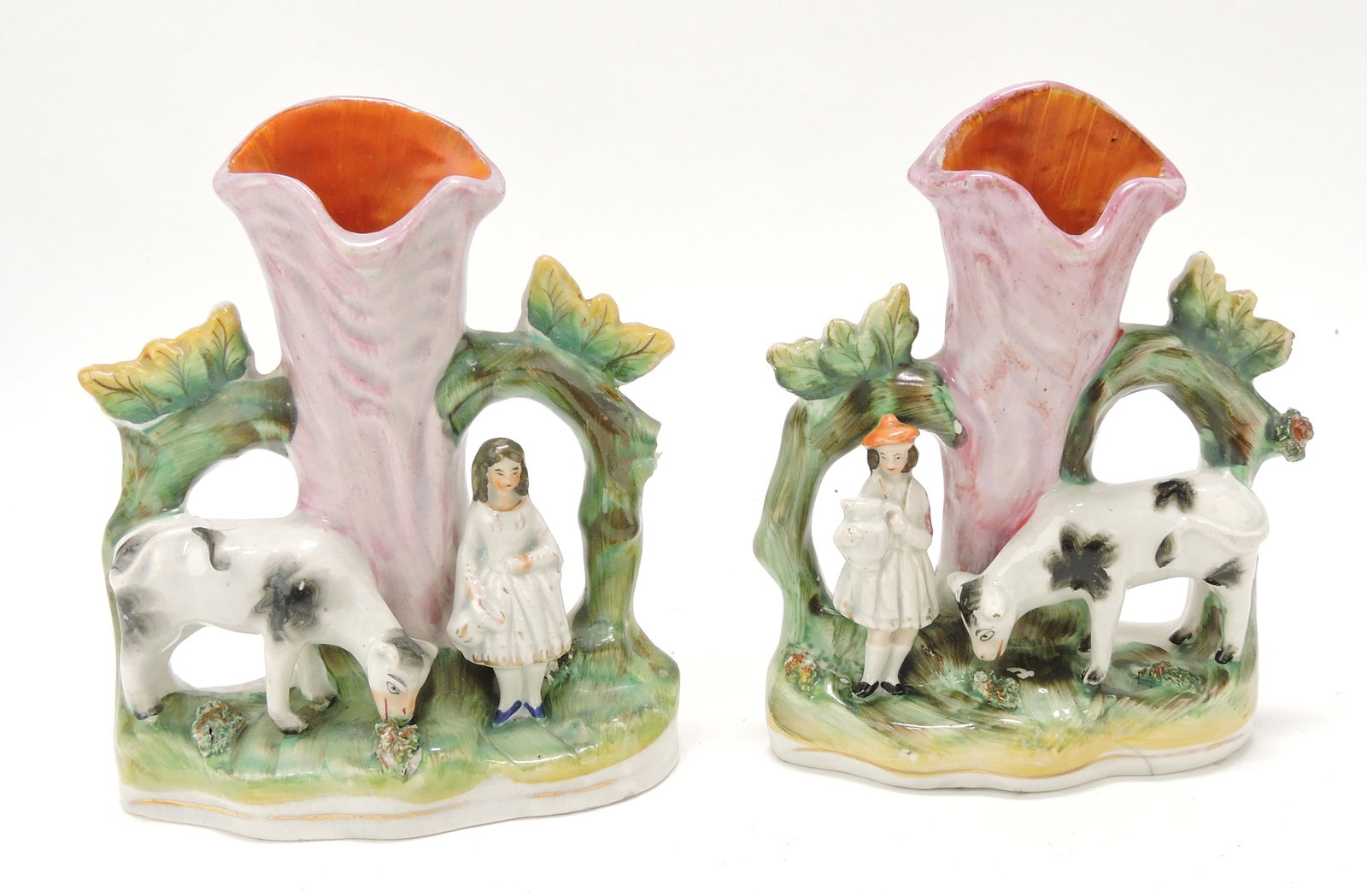 Staffordshire pair of cow spill vases,: 6 1/2", hairline to one
