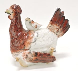 Staffordshire hen on nest with chicks,