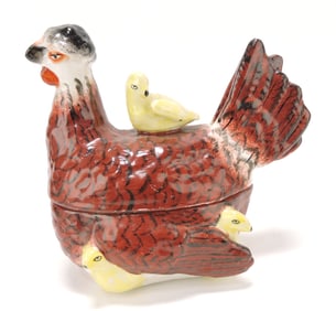 Staffordshire hen on nest with chicks,