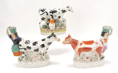 Staffordshire lot of 3 cow figures,