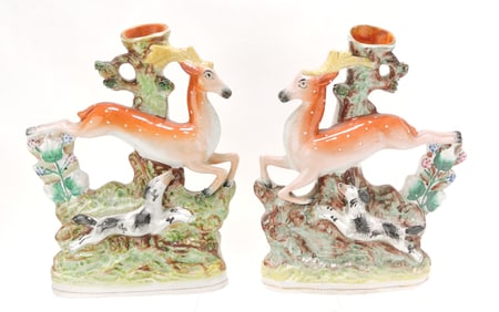 Staffordshire pair of spill vases with dog