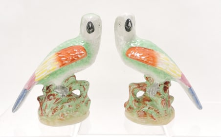 Staffordshire pair of exotic bird figures,