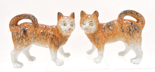Staffordshire pair of standing free leg cats,