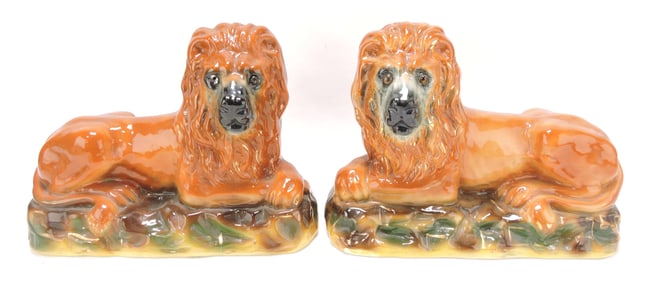 Staffordshire pair of lion figures,