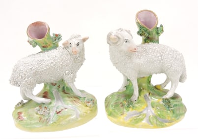 Staffordshire pair of sheep spill vases,