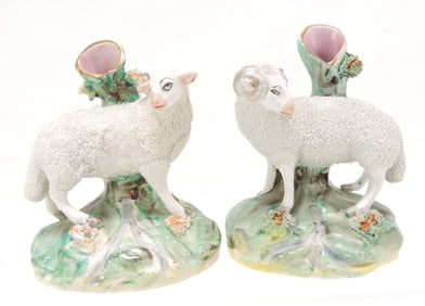 Staffordshire pair of sheep spill vases,
