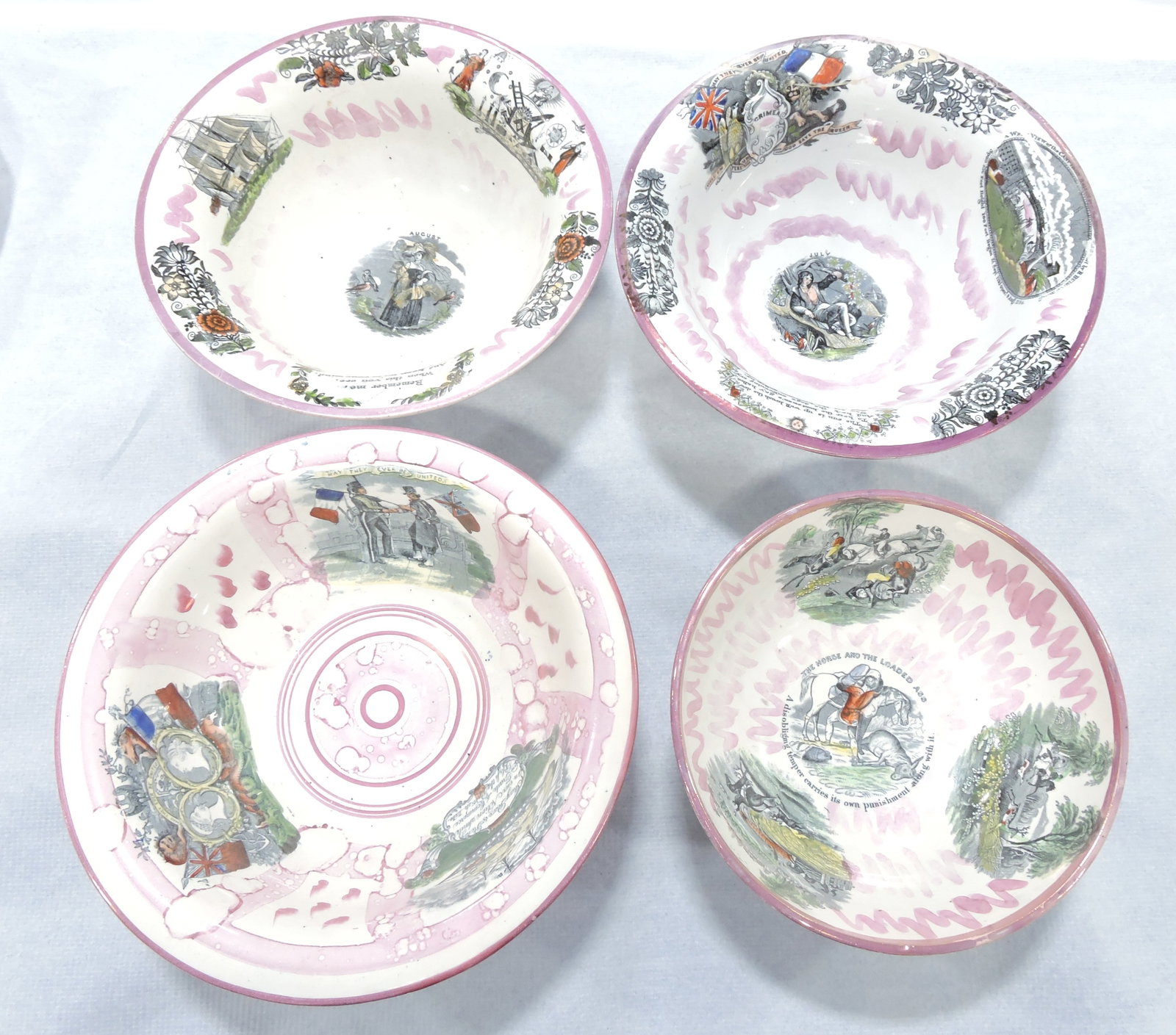 Staffordshire lot of 4 Sunderland pink: luster bowls, 10" to 12 1/2", various condition