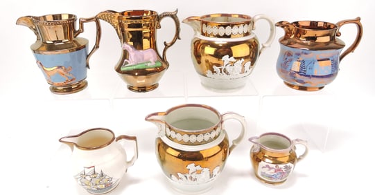 Lot of 7 copper luster jugs, 3 1/2" to