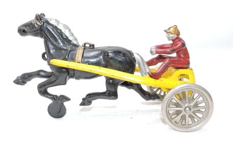 Cast iron horse drawn harness racer,